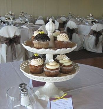 cupcake centerpieces for the tables.  Love this and can buy and borrow enough cute and different cupcake holders. Centerpiece Without Flowers, Dessert Centerpieces Wedding, Cupcake Centerpieces Wedding, Food Centerpieces Wedding, Dessert Centerpieces, Dessert Centerpiece, Book Exchange Party, Benefit Ideas, Cupcake Centerpieces