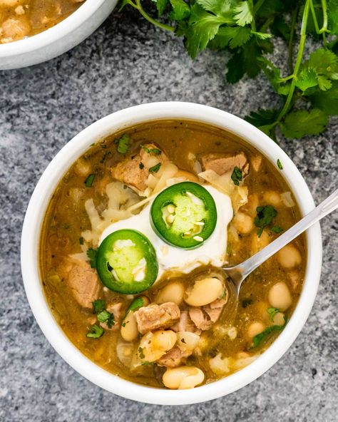 This Chili Verde with white beans and pork is a favorite and easy chili-style recipe. Pork tenderloin is slowly cooked with chilis, green enchilada sauce and many spices. A delicious Mexican-style dish! #chiliverde #pork #chili #recipe Pork Chili Verde Recipe, Crockpot Pork Carnitas, Chili Verde Recipe, Creamy White Chicken Chili Recipe, Chili Verde Pork, Pork Chili, Chili Verde, Crockpot White Chicken Chili, Creamy White Chicken Chili