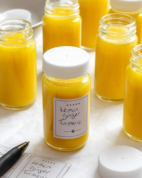 These Lemon Ginger Turmeric Shots are so easy to make and incredibly healthy! Whip them up in just 15 minutes and enjoy all week long! Make these Lemon Ginger Turmeric Shots today! Orange Lemon Ginger Shots, Ginger Lemon Shot Recipe, Lemon Ginger Shot Recipe, Lemon Ginger Turmeric Shots, Ginger Shot Benefits, Ginger Turmeric Shots, Pineapple Shots, Lemon Ginger Turmeric, Ginger Shot Recipe