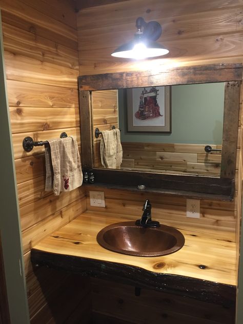 Finished my #rustic bathroom vanity top with this copper sink and cedar epoxy poured countertop. Did a #pallet wood mirror and an old #farm light over them. Cedar Bathroom, Farm Accessories, Bathroom Lighting Over Mirror, Vanity Lighting Over Mirror, Farm Light, Rustic Sink, Copper Sink Bathroom, Cabin Bathroom, Rustic Bathroom Vanities