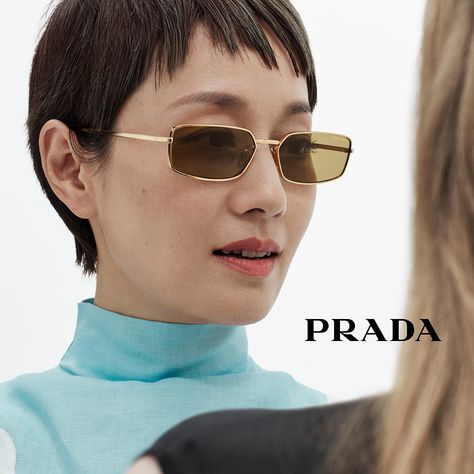 A contemporary approach defines Prada metal sunglasses blending refined details and light silhouettes. Re Edition Prada, Prada Glasses, Prada Re Edition, Ballerina Slippers, Luggage Bags Travel, Sunglasses Women Designer, Messenger Bag Backpack, Prada Eyewear, Denim T Shirt