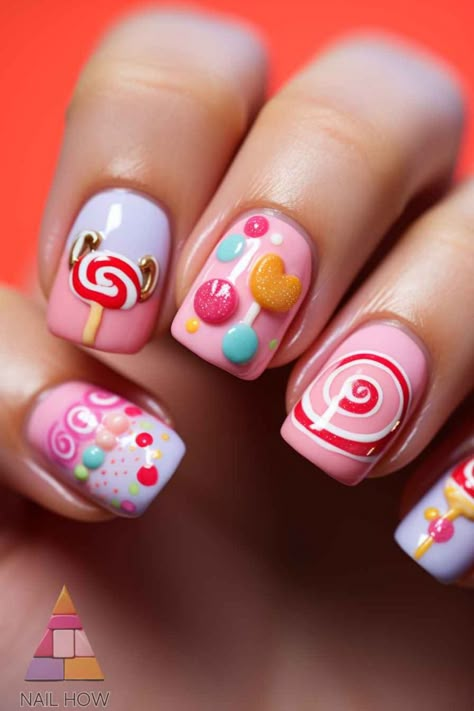 Delight in the joy of candy-inspired nail art with these cute funky nail designs. With swirls of pink and playful candy motifs, these unique nail designs are a treat for the eyes. Sweeten your look by visiting nailhow.com for more. Lolipop Nails Designs, Candyland Christmas Nails, Nail Designs With Swirls, Willy Wonka Nails, Candyland Nails, Candy Land Nails, Candy Nails Designs, Kids Nail Art Designs, Funky Nail Art Designs