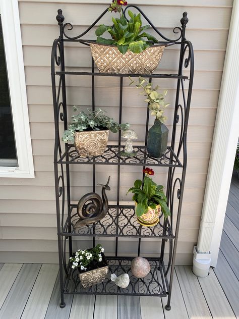 Outdoor Shelf Decor Patio, Patio Shelves Outdoor, Outdoor Bakers Rack Decorating Patio, Outdoor Plant Shelf Ideas, Remodeled Backyard, Bakers Rack Decorating, Patio 2023, Outdoor Bakers Rack, Garden Shelf