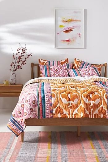 Quilts | Coverlets & Quilt Blankets | AnthroLiving Colorful Boho Bedding, Boho Bed Quilt, Bright Boho Bedroom, Eclectic Bedding, Artsy Prints, Furniture Aesthetic, Rattan Bedroom, Bed Quilt, Anthropologie Uk