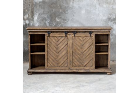 A Craftsman Built Media Piece Finished In Antique Honey Over Mango Veneer, Featuring Chevron Patterned Sliding Doors With Carved Molding Details And A Classic Bun Foot. Aged Black Iron Sliding Hardware Allows For Concealing Or Revealing Multiple Storage Options. Each Side Has Two Adjustable Shelves, With Two Fixed Shelves In The Center. Antique Farmhouse Living Room, Barn Door Media Console, Classic Bun, Uttermost Furniture, Painted Fox Home, Wood Media Console, Media Console Table, Media Table, Wooden Side Table