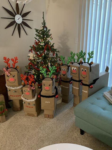 Loved making these Reindeer gift towers for my Grandchildren. Gave them little harnesses with bells on them. Even did little tails for them ❤️ Inspiration from lots of others here on Pinterest. Christmas Present Set Up, Reindeer Package Wrapping Ideas, Christmas Character Wrapping Ideas, Reindeer Tail Diy, Christmas Gift Towers For Kids, Reindeer Wrapped Presents, Gifts From Santa For Kids, Reindeer Present Tower, Reindeer Gift Wrapping Ideas