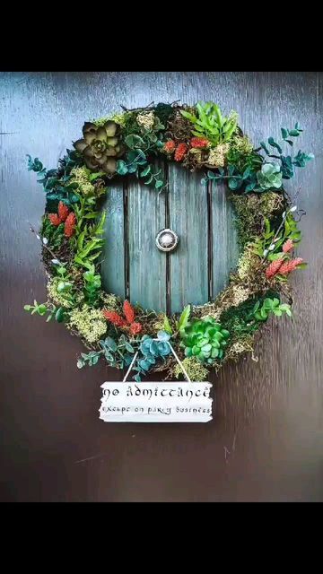 Michelle | Green Eyed Bookworm on Instagram: "I saw someone make this hobbit hole door wreath on Tiktok, and HAD to have one. I think it's the most fun I've had making a craft project. �▪️ If you make one, please tag me - I'd LOVE to it!! 🖤🖤 ▪️ Side notes: apologies for the poor video quality - we don't get the best lighting💡in our dining room. I also tried finding the creators on Instagram that inspired me, but had some trouble. They'll be tagged in my TikTok video ☺️ Candle (battery operated Hobbit Door Wreath, Hobbit Hole Door, Video Candle, Hobbit Christmas, Hobbit Door, Nick Nacks, Hobbit Hole, Wreath Tutorial, Tiktok Video