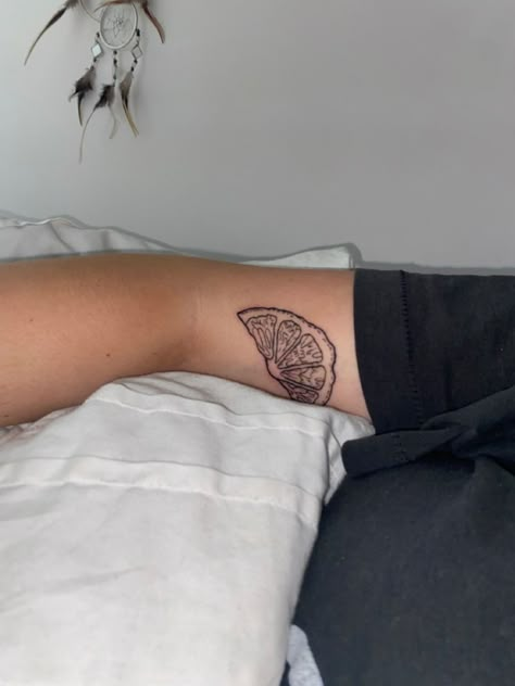 Orange slice tattoo. Lemon wedge tattoo Like Wedge Tattoo, Sliced Fruit Tattoo, Oranges Tattoo Fruit, Orange Outline Tattoo, Orange Slice Tattoo Traditional, Lemon Slice Tattoo Minimalist, Orange Slice Tattoo Black And White, Orange Wedge Tattoo, Citrus Slice Tattoo