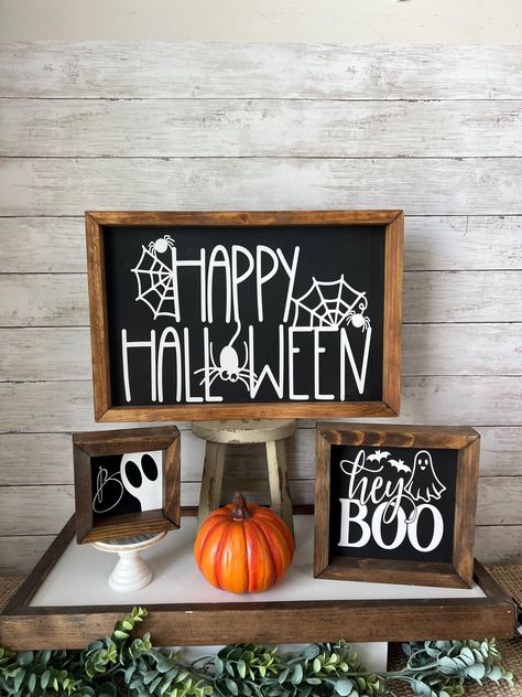 Pretty yet spooky Halloween Wood Framed Signs! Perfect to hang or easily display on your counter, shelf, or mantle! All three signs come as shown and are ready to ship! Each sign easily stands freely on its own. A hanger is not included, but the back of the frame can easily sit on a nail or wall hook. Happy Halloween- 18''x12'' Hey Boo-8''x8'' Boo-5''x5'' Frames are premium wood, but as with all wood there may be imperfections that make them special and unique :) Enjoy free shipping on this item!!  This listing is for one sign of your choice. Other decor in photos is not included, Thanks for stopping by my shop! Small Halloween Signs Wooden, Diy Halloween Signs, Happy Halloween Sign, Halloween Sign, Wooden Halloween Signs, Boo Halloween Sign, Halloween Signs Diy, Halloween Mantle Decor, Halloween Wood Signs