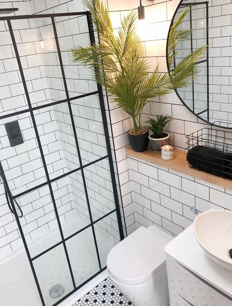 This is such a modern bathroom with the crittall style shower screen, the penny tiles on the floor and the metro tiles on the wall. The industrial style mirror works so well here too. Shower room in the home of  inside_the_white_house on Instagram. Modern Shower Room, Home By The Sea, Small Shower Room, Bilik Air, Seaside Home, Ensuite Shower Room, Small Bathroom With Shower, Small Bathroom Interior, Loft Bathroom