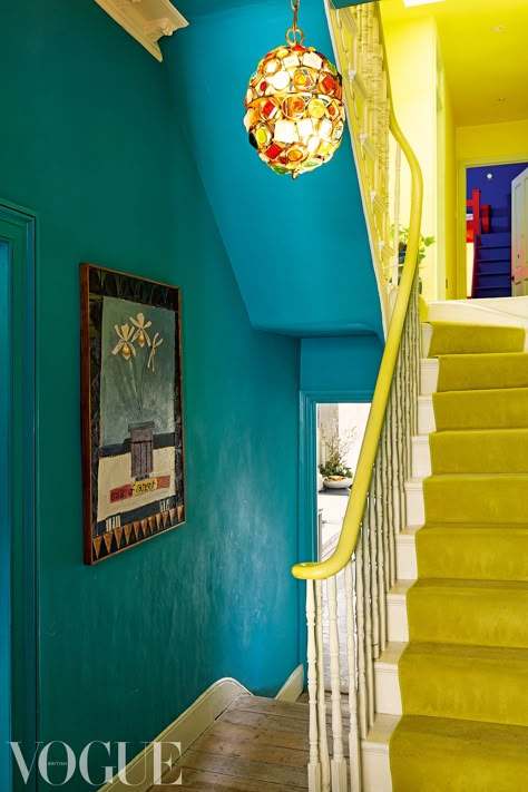 Yellow And Blue Hallway, Colorful Stairwell, Leopard Stairs, Bright Hallways, Blue Hallways, Bright Staircase, Paint Hallway, Yasmin Sewell, Bright Hallway