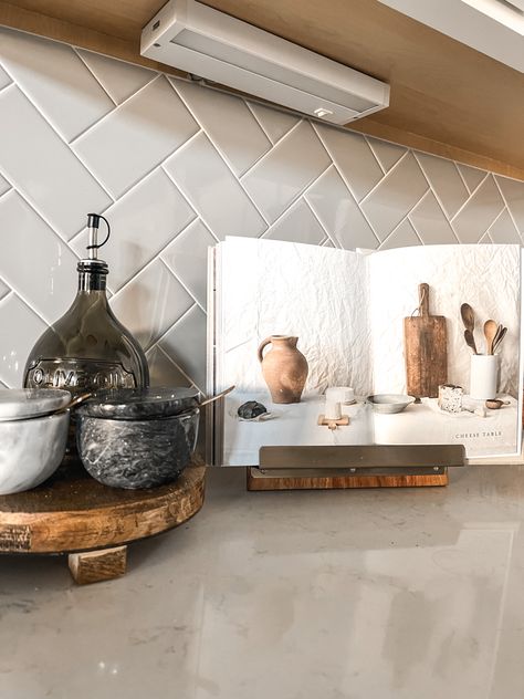 Herringbone Kitchen Backsplash, Counter Styling, Kitchen Counter Styling, Herringbone Kitchen, Moody Kitchen, Salt And Pepper Cellars, Cookbook Stand, Organisation Ideas, Cook Book Stand