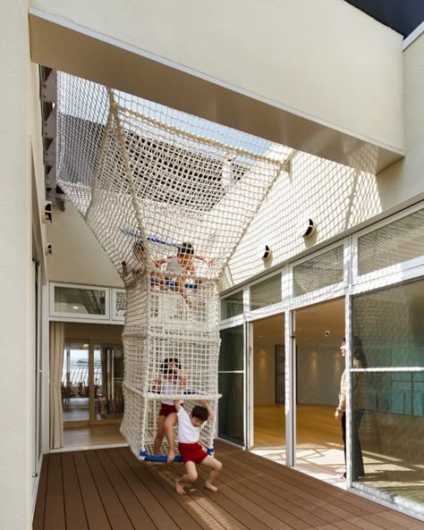 HIBINOSEKKEI + youji no shiro top OB kindergarten with rooftop playground photography is by studio bauhaus, ryuji inoue Camping Hammock Ideas, Cool Playgrounds, Kids Backyard Playground, Indoor Hammock, Kindergarten Design, Diy Playground, Indoor Climbing, Playground Design, Children Playing