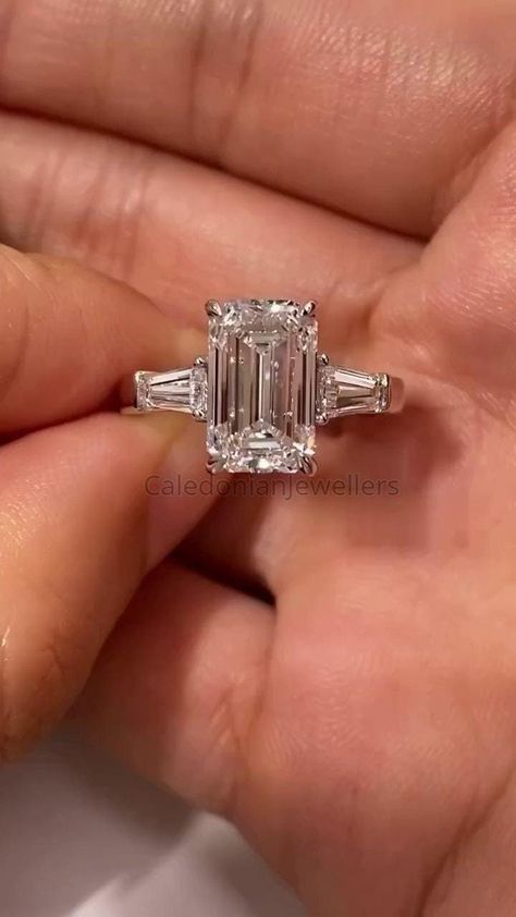 Emerald Cut Three Stone Ring, 4.0 CT Emerald Cut Colorless Moissanite Engagement Ring, Tapered Baguette Side Stone Anniversary Gift for Her. 💎𝐑𝐢𝐧𝐠 𝐂𝐞𝐧𝐭𝐞𝐫 𝐒𝐭𝐨𝐧𝐞: ✤ 𝐒𝐭𝐨𝐧𝐞 𝐓𝐲𝐩𝐞: Moissanite  ✤ 𝐒𝐭𝐨𝐧𝐞 𝐒𝐡𝐚𝐩𝐞: Emerald Cut (4 CT) ✤ 𝐒𝐭𝐨𝐧𝐞 𝐒𝐢𝐳𝐞 𝐀𝐯𝐚𝐢𝐥𝐚𝐛𝐥𝐞: 0.20CT(2*4mm), 0.50CT(3*5mm), 0.80CT(4*6mm), 1CT(5*7mm), 2CT(6*8mm), 3CT(7*9mm), 4CT(8*10mm), 5CT(9*11mm), 8CT(10*12mm), 10CT(10*14mm), 12CT(12*14mm) ✤ 𝐂𝐨𝐥𝐨𝐫: D color ✤ 𝐂𝐥𝐚𝐫𝐢𝐭𝐲: VVS1 clarity Emerald With Baguettes Engagement, Emerald Engagement Ring 3 Stone, Diamond Emerald Cut Ring, Emerald Cut 3 Stone Ring, Baguette Side Stone Engagement Ring, Emerald Cut With Tapered Baguettes, Classic Winston Emerald-cut Engagement Ring With Tapered Baguette Side Stones, Emerald Baguette Engagement Ring, Emerald Cut Engagement Ring Thick Band