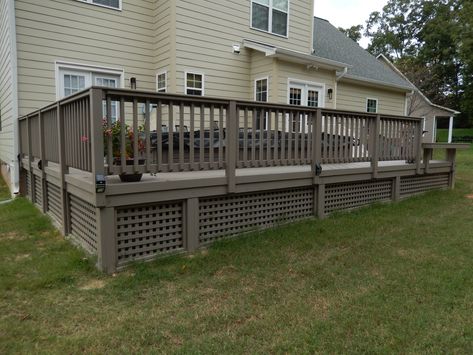 Get your exercise and also relax and enjoy the beautiful outdoors on your low maintenance deck with custom railing. AZEK makes a great decking choice for this lovely deck with pool spa. Deck Underpinning, Deck Underpinning Ideas, Porch Underpinning, Deck With Pool, Deck Skirt, Deck Skirting Ideas, Porch Lattice, Veranda Ideas, Skirting Ideas