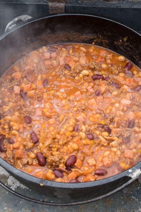 Cowboy Beans an award-winning recipe. Step by Step directions for cooking with Cast Iron Dutch Oven over Charcoal and additional directions for Baking or Crock-Pot to fit everyone's needs. These Baked Beans can be served as a side dish or a meal. Perfect recipe for BBQ Potlucks and Camping. #lodgecastiron #devourdinner #devourpower #cowboybeans #easyrecipe #familyrecipe #BBQWeek #dutchoven #dutchovencooking #bakedbeans #dutchovenbeans #iammartha #fathersdayrecipe #campingmeals #campingrecipe Bacon Beans, Dutch Oven Soup, Dutch Oven Recipe, Ceramic Dutch Oven, Cooking With Cast Iron, Dutch Oven Recipes Cast Iron, Dutch Oven Camping Recipes, Beans In Crockpot, Bbq Beans