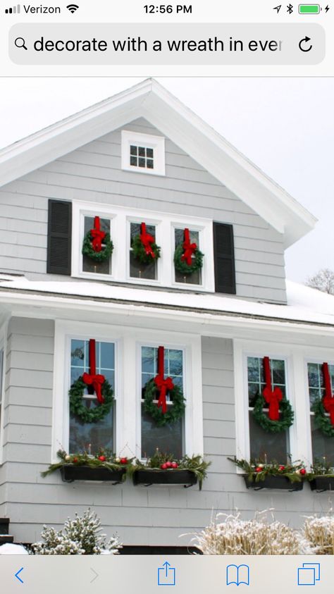 Wreath Above Garage Door, Wreaths On All Exterior Windows, Wreath On Every Window, Christmas Wreaths On House Windows, Exterior Xmas Decorations, Decorating Windows For Christmas Outside, Christmas Wreath For Window, Outdoor Wreaths On House Windows, Window Christmas Wreaths Outdoor