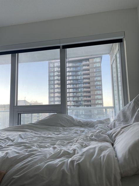 white bed in front of a large window overlooking Toronto skyline Apartment, Instagram Photos, Photo And Video, Instagram Photo, Instagram