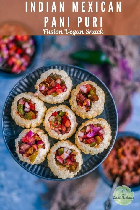 Pani puri recipe gets a Mexican Indian fusion makeover! Here, the puris are filled with Mexican food - beans & salsa to give this vegan Asian snack a whole new flavor! Makes for a crunchy, tasty snack that's loved by all! #panipuri #Mexican #Indian #fusion #vegan #snack #streetfood #howtomake #salsa #beans #plantbased #appetizer Mexican Pani Puri, Fusion Food Ideas, Indian Finger Food, Paani Puri, Indian Starters, Indian Buffet, Mexican Fusion, Pani Puri Recipe, Snack Easy