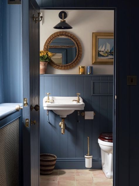 We love how the Antique Brass fittings of the Lucia is echoed throughout this space. The Lucia range is available in eleven colours and our standard metal finishes. It can be fitted with an IP44 Osh lamp for use within Zone 2 in bathrooms. There are three models of the Lucia wall light and a range of pendants which can be used throughout the home. @annahainesdesigns 📷 @andrewdsteel #designerlighting #homelighting #walllights #wallight #powderroomdeco Blue Powder Room, Norfolk Cottages, Blue Bathrooms Designs, Navy Blue Bathrooms, Navy Bathroom, Light Wooden Floor, Tongue And Groove Panelling, White Bathroom Designs, Cottage Renovation