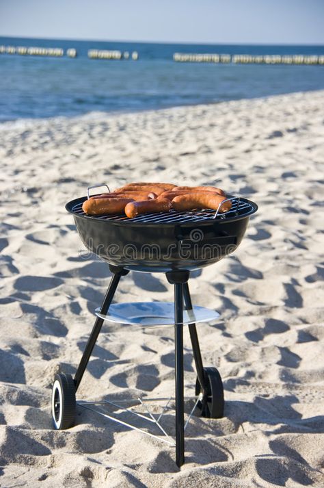 Barbecue on beach. A portable barbecue on a beach, tasty sausages on the grill , #sponsored, #portable, #beach, #Barbecue, #barbecue, #grill #ad Beach Barbeque Party, Beach Grilling, Beach Bbq Party, Beach Grilling Ideas, Beach Barbecue Aesthetic, Barbecue Photography Food Styling, Beach Barbeque, Beach Party Food, Kids Beach Party