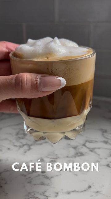 DANIELLE ✨ on Instagram: "Café Bombon☕️ Café Bombon is a sweet espresso drink that is popular in Spain, and traces its roots from Valencia! It’s a strong shot of espresso served with sweetened condensed milk, and I topped mine with some frothed milk for a touch of fluff☁️ Because of its widespread familiarity, Café Bombon is now found in many variations from different parts of Europe, and even different continents😍 How beautiful does it look? And yes, it is sweet and delicious!✨ What is a sp Espresso Drink, Specialty Coffee Drinks, Shot Of Espresso, Condensed Milk Recipes, Learning To Cook, Espresso Drinks, Frothing Milk, Drinks Coffee, Sweetened Condensed Milk