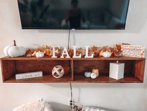 Hobby Lobby for the letters, TJ Maxx for the pumpkins, and Michaels for the sign & leaf garland Fall Tv Stand, Fall Tv Stand Decor, Tv Stand Decor, Fall Tv, Decor 2023, Fall Halloween Decor, Leaf Garland, Autumn Decor, Decor Lighting