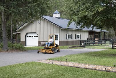 This horse barn/garage was built for Harold & Jennie of Reddick, FL  Special Features:    Morton's Hi-Rib Steel  Cupolas  Porch  Double Dutch Door... Pole Barn Designs, Pole Barn Garage, Equestrian Building, Riding Arena, Morton Building, Horse Barn Designs, Horse Barn Plans, Brick Siding, Steel Frame House