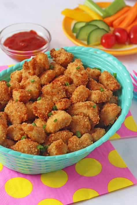 Healthy Baked Popcorn Chicken. My recipe for this delicious Popcorn Chicken is baked not fried yet it's still super crispy thanks to my secret ingredient - Rice Krispies! #popcornchicken #bakedchicken #kfcchicken Nursery Food Menu Ideas, Chicken Recipes For Toddlers, Toddler Chicken Recipes, Baked Popcorn, Baked Popcorn Chicken, Recipes For Toddlers, Popcorn Chicken Recipe, Chicken Recipes For Kids, Chopped Vegetables