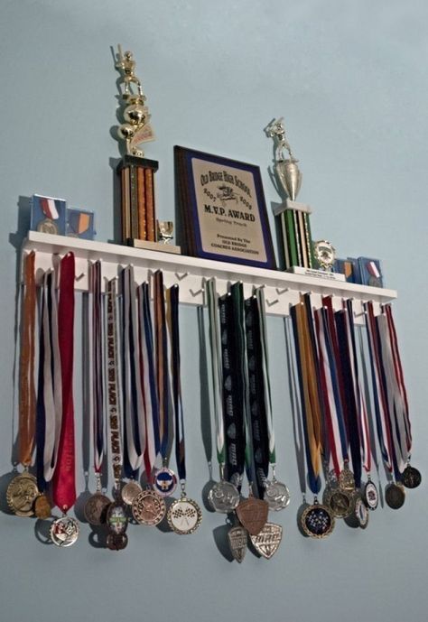 johnny kavanagh Shelf With Pegs, Johnny Kavanagh, Basketball Trophies, Running Medal Holder, Trophy Shelf, Trophy Display, Running Medals, Award Display, Sports Medals