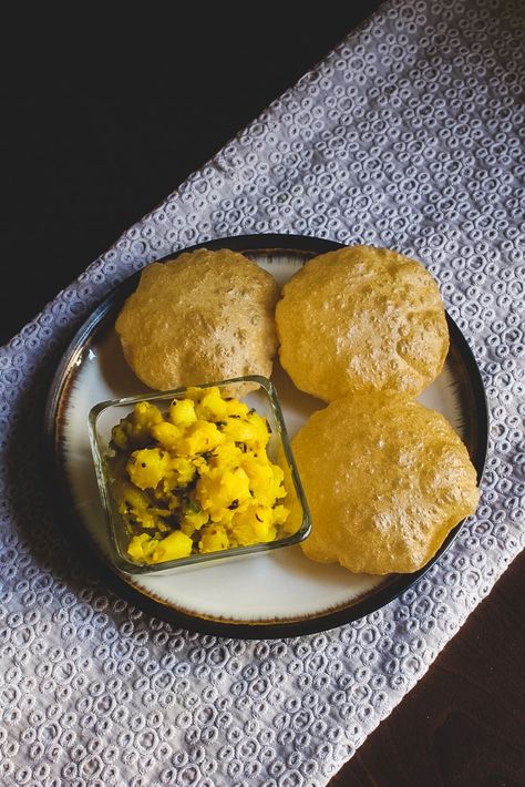 The easiest, tastiest poori bhaji recipe! A classic combo where mildly flavored potato curry is served with hot, puffy puris. It’s a popular breakfast or brunch or lunch buffet dish in India. Every region has its own version. This one is Maharashtrian style puri bhaji. This is the famous street food in Mumbai. Learn how to make puri bhaji with step by step photos and tips. #breakfast #indianfood #comfortfood #brunch Potato Bhaji Recipe, Poori Bhaji, Aloo Bhaji, Breakfast Photos, Famous Street Food, Story Food, Vegetarian Ideas, Food Posters, Yummy Bites