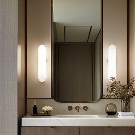 NINA MAGON on Instagram: "This stunning powder bathroom design by @ninamagonstudio effortlessly blends contemporary and classical design elements. A sleek vanity with a marble countertop and elegant polished fixtures adds sophistication, while a full height, modern mirror reflects the light and creates a sense of grandeur. The lighting includes recessed ceiling lights and wall sconces, while tasteful accessories complete this luxurious and timeless space. #ninamagonstudio #immerseyourself Desi Full Height Mirror Design, Wall Light Mirror Bathroom, Wall Lights Mirror Bathroom, Classic Mirror Wall, Powder Bathroom Design, Sconces Bathroom Mirror, Modern Classic Bathroom, Lit Mirror, Powder Bathroom