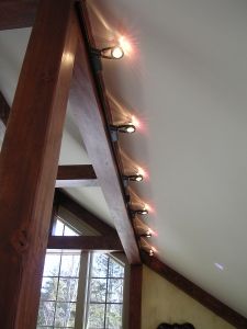 Small halogen track lighting is useful as it can be hidden by a beam yet project optimal lighting. Track Lighting Living Room, Hanging Pendant Lights Bedroom, Rustic Track Lighting, Basement Stairwell, Vaulted Ceiling Lighting, Lighting Living Room, Stairwell Lighting, Timber Frame Home, Just Done