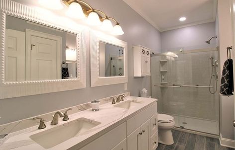 Onyx Bathroom Remodel from Michaela | Capitol Kitchens and Baths Onyx Bathroom Countertop, Onyx Bathroom Ideas, Bathroom Countertop Ideas, Onyx Bathroom, Cambria Countertops, Countertop Ideas, Stock Cabinets, Shower Wall Panels, Tub Surround