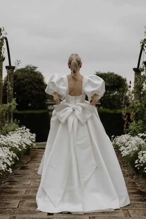 mabel-collection-dress-lyn-ashworth-2 Long Sleeve Bow Wedding Dress, Bridal Gown With Bow, Wedding Dresses With Bows On Back, Wedding Dress Balloon Sleeves, Wedding Dress With Bow On Back, Bubble Wedding Dress, Big Bow Wedding Dress, Wedding Gown With Bow, Wedding Dress With Bows