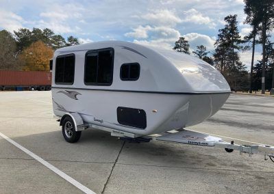 Snoozy Queen - Best Tow Behind Camper - The Snoozy Tow Behind Camper, Entertainment Shelves, Compact Microwave, Shower Floor Mat, Calcutta Marble, Frame Drum, Air Fan, Countertop Options, Air Conditioning Unit