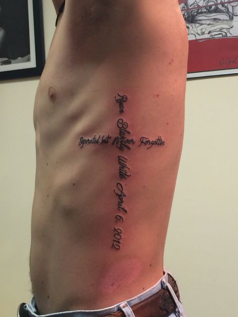 Never forgotten Cross scripture rbw remembrance tattoo rib Christ God Rib Cage Tattoos For Men, Rib Tattoos Words, Tattoo Rib, Rib Tattoos For Guys, Bible Verse Tattoos, Word Line, Verse Tattoos, Ribcage Tattoo, Remembrance Tattoos