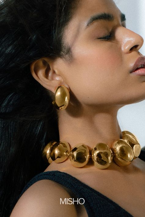 MISHO’s for Ajio Luxe is a capsule collection of timeless jewellery silhouettes with a contemporary reimagining. Look no further for the perfect statement pieces to add to your collection. Ft. here, the Ovo Choker and Ovo Hoops. statement jewellery, statement jewelry, gold jewellery, gold jewelry editorial photography #misho #newcollection #newedit #statementjewellery #statementjewelry #goldjewellery #goldjewelry Avant Garde Jewelry, Jewelry Store Design, Jewelry Editorial, India Jewelry, Maximalism, Stacked Jewelry, Layered Jewelry, Layered Bracelets, Timeless Jewelry