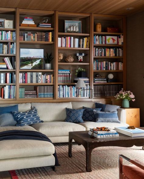 Built In Window Shelves, Lights In Built In Shelves, Walnut Bookshelves Built Ins, Bookcase Wall Behind Sofa, Cottage Built In Bookcase, Couch In Front Of Bookcase, Brown Built In Shelves Living Room, Bookshelves Around Sofa, Built In Bookshelf Vaulted Ceiling