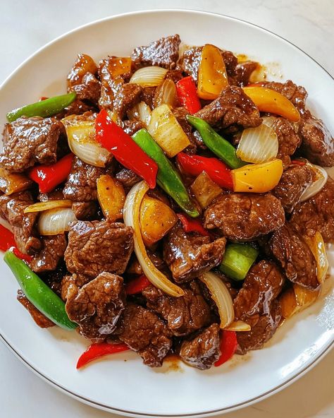 Bring the vibrant flavors of Chinese cuisine to your kitchen with our Chinese-Style Beef and Onion Stir-Fry Recipe. This quick and easy recipe combines tender strips of beef with crisp, savory onions in a rich, flavorful sauce that's sure to satisfy your taste buds. Perfect for busy weeknights or a delicious weekend meal, this beef and onion stir-fry offers a delightful blend of umami and spice that mirrors your favorite takeout dishes. The recipe is designed for simplicity and speed, making it Steak Stirfry Recipes, Pork Stir Fry, Chinese Cooking Recipes, Weekend Meals, Pepper Steak, Spicy Pork, Chinese Cooking, Stir Fry Recipes, Asian Dishes