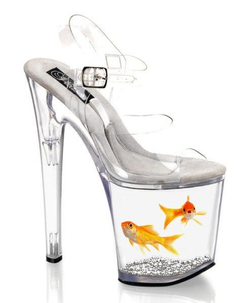 Lucite Goldfish Heels-The sole slides out so that you can feed the fishes. | I'd feel too bad for the fish....maybe just for a short field trip....even though I don't know where you would go in these, still like them! HT Weirdest Shoes, Weird Shoes, Crazy Heels, Kasut Tumit Tinggi, Funny Shoes, Clear High Heels, Art Shoes, Internet Art, Ugly Shoes