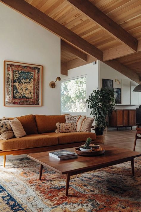 ♥ Are you dreaming of a cozy and stylish living room with a touch of 70s interior design? Step into this Mid Century Modern living room, a blend of boho and modern aesthetics. From the earthy tones to the accent walls, this space screams "cozy living room goals". ✨🌿 #mcmLivingRoom #70sInteriorDesign #CozyLivingRoom #NeutralLivingRoom #LivingRoomInspiration Boho Great Room, Mid Century Indian Living Room, Living Room Designs 70s, Midcentury Ranch Living Room, Farmhouse Colorful Living Room, Rust Velvet Couch Living Room Ideas, Natural Modern Farmhouse Living Room, 70s Southwestern Interior, Boho Mid Century Modern Living Room Colorful