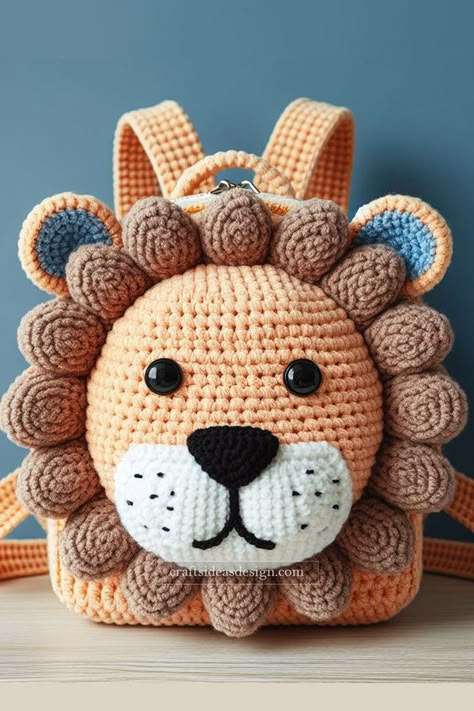 The adorable crochet lion backpack is a delightful creation perfect for any crochet enthusiast. Featuring a warm orange body with a detailed brown mane, this backpack captures the essence of cuteness and playfulness. The large, expressive eyes and the intricate nose and mouth detailing add to the lion's charming appearance. Crochet Backpack Pattern, Patriotic Hats, Crochet Lion, Crochet Backpack, Expressive Eyes, Crochet Pouch, Adorable Crochet, Handbag Pattern, Crochet Animal Patterns