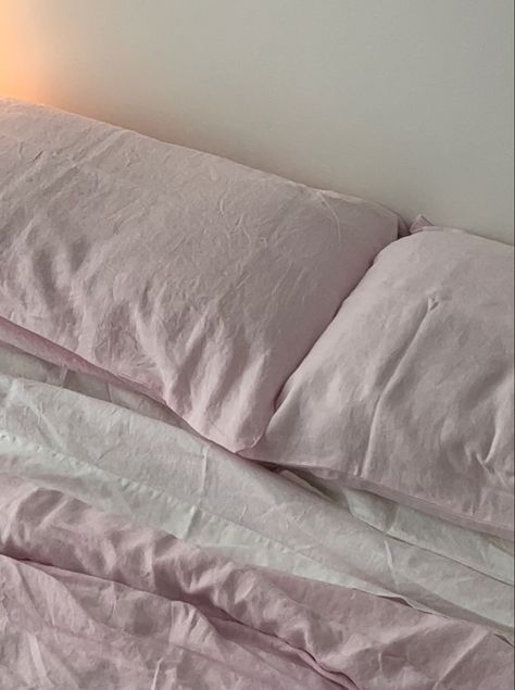 closeup of bed showing the pastel pink duvet cover and pillows with white sheets Pink And White Bedding Set, Pink And White Bed Sheets Aesthetic, Pink Comforter Aesthetic, Pink And White Bedsheets, White Pink Bedding, Pastel Linen Bedding, Pink And Grey Coquette, Pastel Pink And Grey Bedroom, Light Pink Bedding Aesthetic