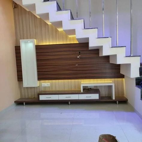 Under Stair Decoration Ideas ✨️| Stair Design Ideas ✨️ #railing #understairs #stairs #understairstorage #stairdesign #stairdesigns #glassrailing #understairsstorage #homedesignsdworld #explorepost #explorepage #reeelitfeelit #trendingdesigns #railingdesign #budget2024 #yogawithwall #celebritystylist #bhindifry #rafaelnadal Staircase Down Tv Unit, Duplex Steps Wall Design, Tv Below Staircase, Tv Unit Under Staircase Living Rooms, Tv Under Stairs Living Room, Tv Unit Under Staircase, Rafters Design, Design Under Stairs Ideas, Stairs Tv Unit