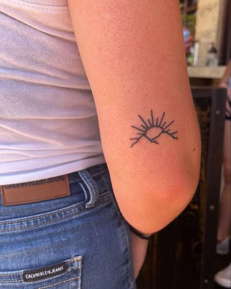 Simple Sun Rise Tattoo, Sun With Mountains Tattoo, Sun And Moutain Tattoos, Sun Rising Over Mountains Tattoo, Sunshine Mountain Tattoo, Cute Arm Tattoos For Women Simple, Back Of The Arm Tattoo For Women Simple, Sun Tattoo Above Elbow, Mountain And Sun Tattoo Simple