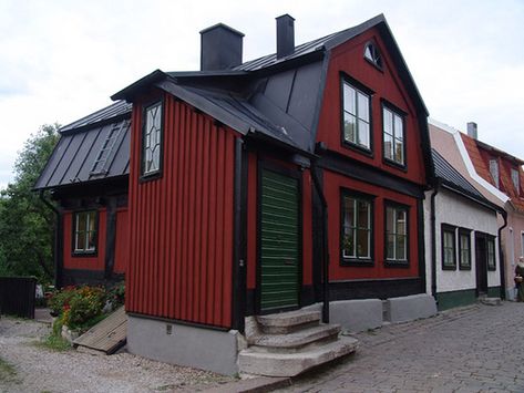 Traditional Swedish house with red paint and black trim... Thinking about working this look onto our house over time. Red And Black House Exterior Colors, Red And Black House, House Black Trim, Red House Exterior, Barn Colors, Santa Village, Corrugated Steel, Dark Trim, Red Houses