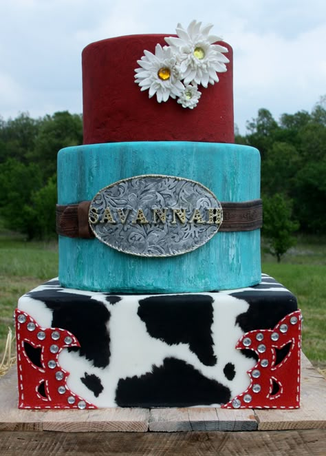 Children's Birthday Cakes - I made this cowgirl cake for my daughter's 9th birthday bash. Bottom tier is hand painted cow print, red alligator skin fondant with bling. Middle tier is hand painted distressed wood look with fondant leather belt and gumpaste belt buckle. The top tier was supposed to look like imprinted leather, but it didn't show up as much as I had hoped it would. Gumpaste daisies with bling centers. Birthday Cake Cowgirl, Country Birthday Cakes, Cowgirl Birthday Cakes, Western Birthday Cakes, Country Cakes, Western Cake, Western Wedding Cakes, Cowgirl Cake, Horse Cakes