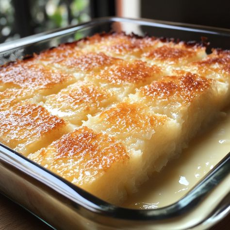 🥥 "Taste the tropical goodness of Cassava Cake with Coconut Milk—a moist and delicious dessert!" 🥥🍮 #CassavaCake #CoconutLovers Cassava Cake with Coconut Milk Ingredients: Grated cassava (2 cups) Coconut milk (1 cup) Condensed milk (1/2 cup) Sugar (1/2 cup) Eggs (2, beaten) Butter (1/4 cup, melted) Cheddar cheese (1/2 cup, grated, for topping) Instructions: Preheat oven to 350°F (175°C). Grease a baking dish. In a bowl, combine grated cassava, coconut milk, condensed milk, sugar, eggs, an... Cake With Coconut Milk, Cassava Cake, Cake With Coconut, Instagram Recipes, Sugar Eggs, Trending Recipes, Coconut Recipes, Baking Dish, Condensed Milk