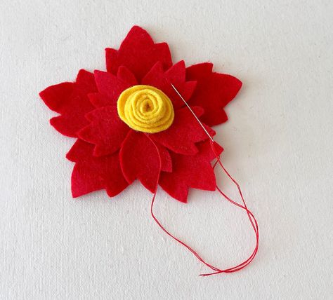 Use our free pattern to make a poinsettia ornament with felt. This DIY Christmas ornament uses hand stitching. Diy Felt Poinsettia, Felt Poinsettia, Leaf Cutout, Ornament Template, Diy Christmas Ornament, Diy Felt, Flower Center, Handmade Christmas Ornaments, Felt Diy